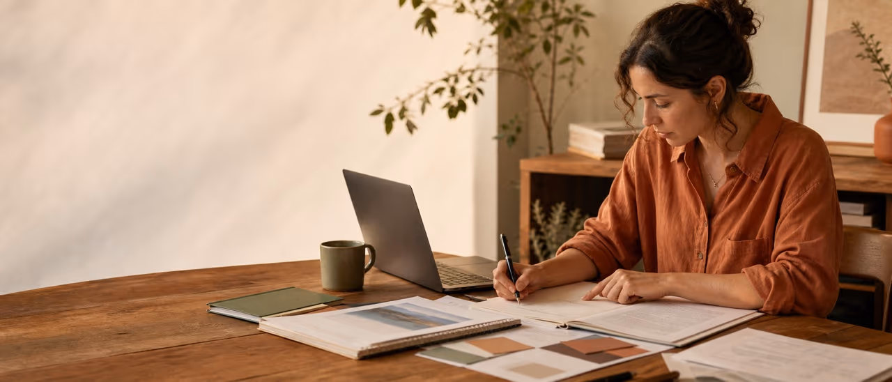 A professional drafting a training motivation letter beside course and vacancy notes